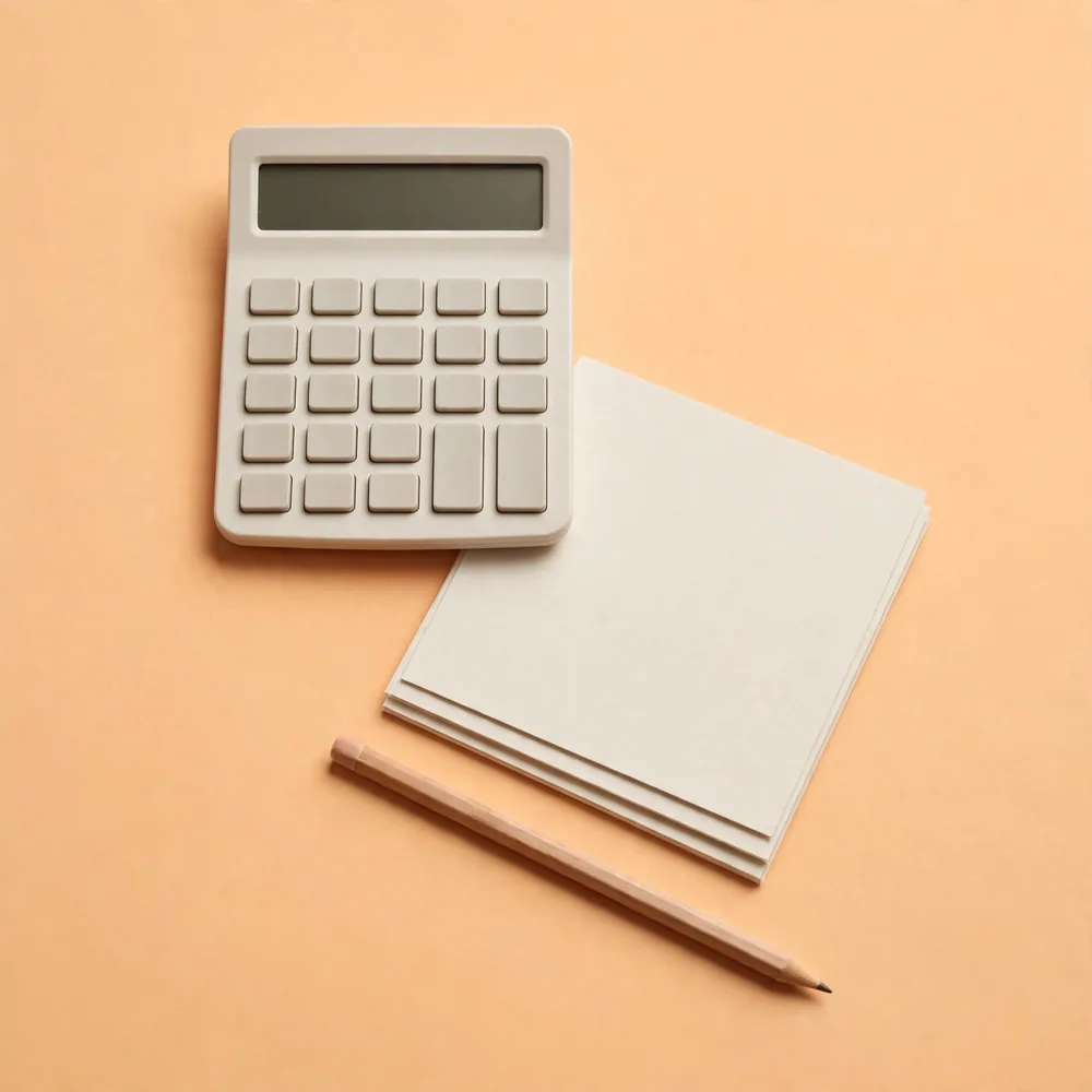 A calculator, cards and a pencil